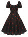 Robe noire imprimé cerises manches bouffantes années 1950