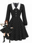 Robe noire à pois col Chelsea et manches longues années 1950