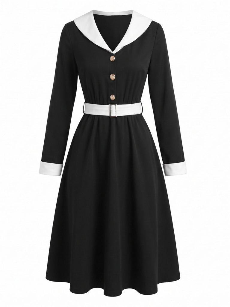 Robe noire et blanche à revers, col V et manches longues années 1950