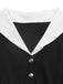 Robe noire et blanche à revers, col V et manches longues années 1950