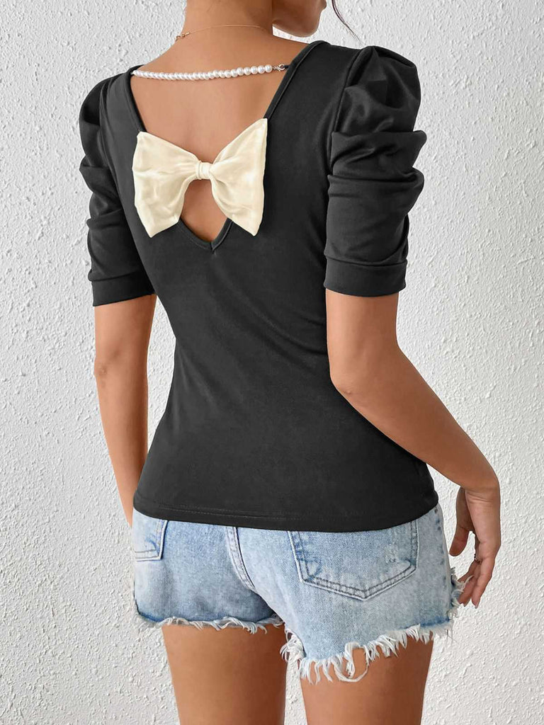 Haut noir manches bouffantes et nœud dans le dos avec perles des années 1940