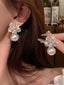 Boucles d'oreilles pendantes cristal blanc et perles flocon neige