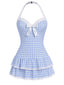 Maillot de bain une pièce bleu clair à pois et nœud des années 1940