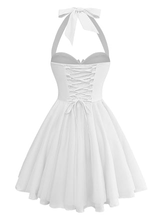 White halter-neck dress with lace-up front on a white background
