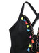 Side profile view showing the depth of the V-neck and the placement of the decorative tassels.