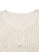 Close-up of the intricate oval cut-out detailing and V-neckline on a cream crochet tunic.
