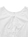 Close-up of the charming bow tie neckline and soft gathered fabric on the bodice of the white retro shirt.