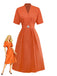Robe unie orange à col en V et boutons et broche années 1940