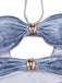 Close-up of the center bodice highlighting the oval gold-tone beads and the ruched fabric around the cut-outs.