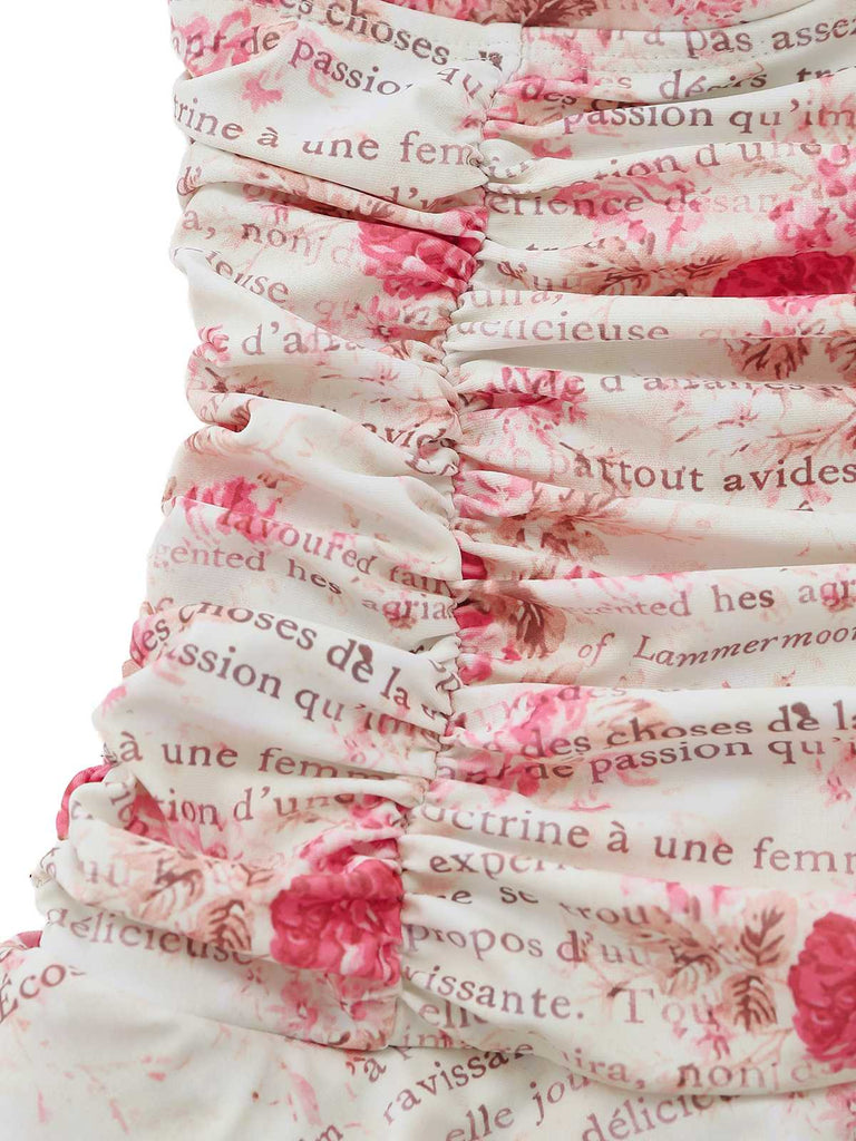 Close-up of the side ruching on the bodice, showing the pink rose and cursive text print on white fabric.