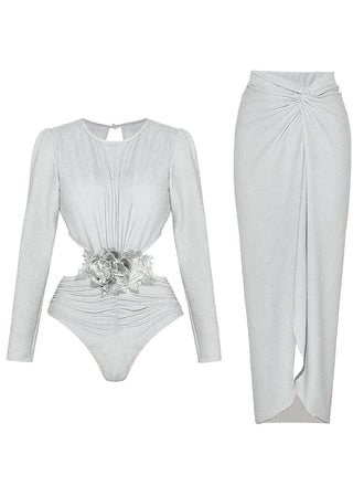 Flat lay view of the silver shimmer bodysuit and the matching high-waisted long skirt laid out separately.
