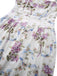 Detailed view of the fitted waistline and structured bodice seams featuring the blue ribbon and flower motif.