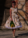 Robe jaune à fleurs antique col bateau ceinturée années 1950